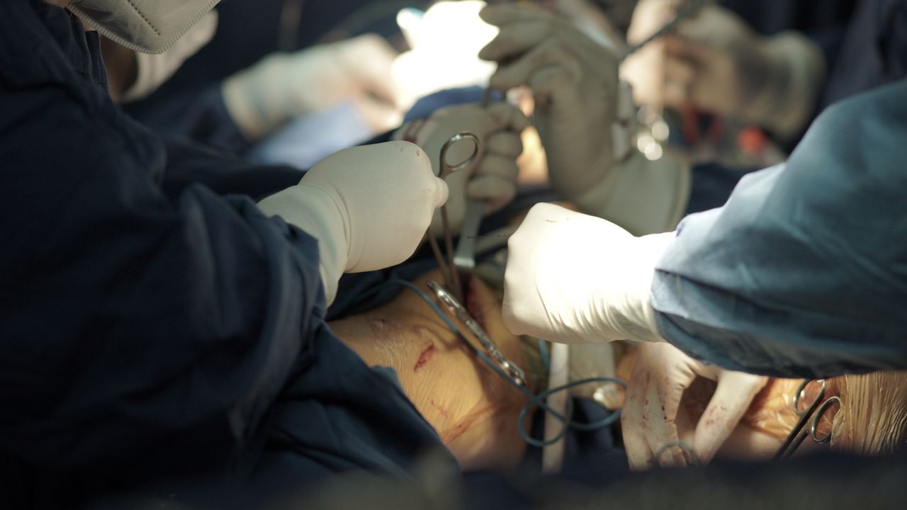 The Art of Drawing Readers In: Your attractive post title goes here Team of surgeons executing a delicate surgical procedure in an operating room.